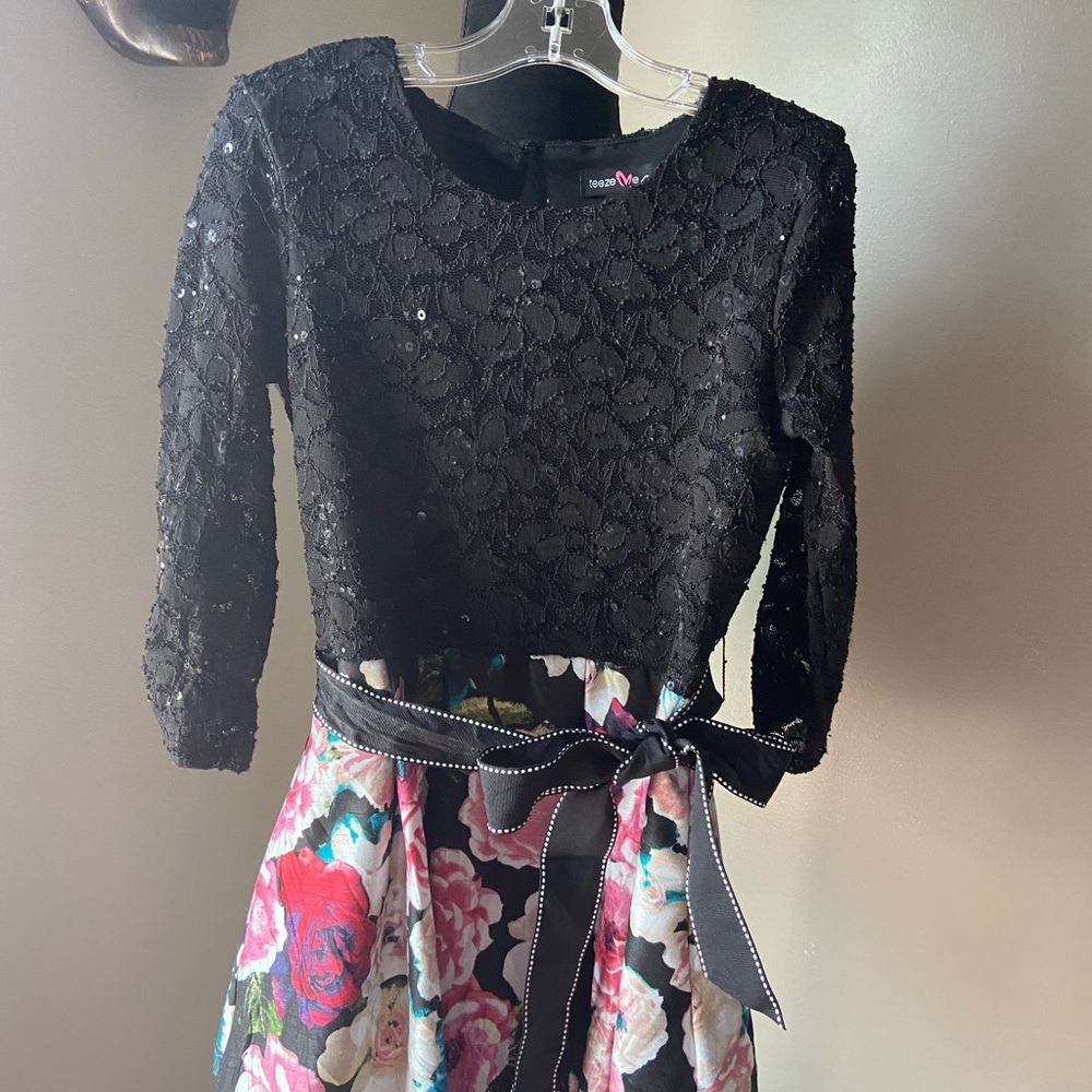 This is a TEEZE MEGIRL size 8 black pink blue sequence Dress